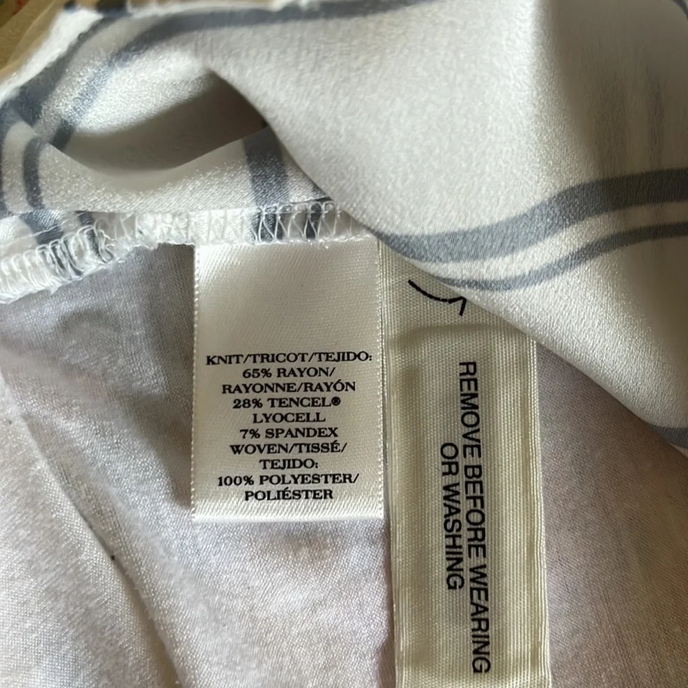 Ann Taylor long sleeved blouse. White with blue stripes and metal buttons. Sm